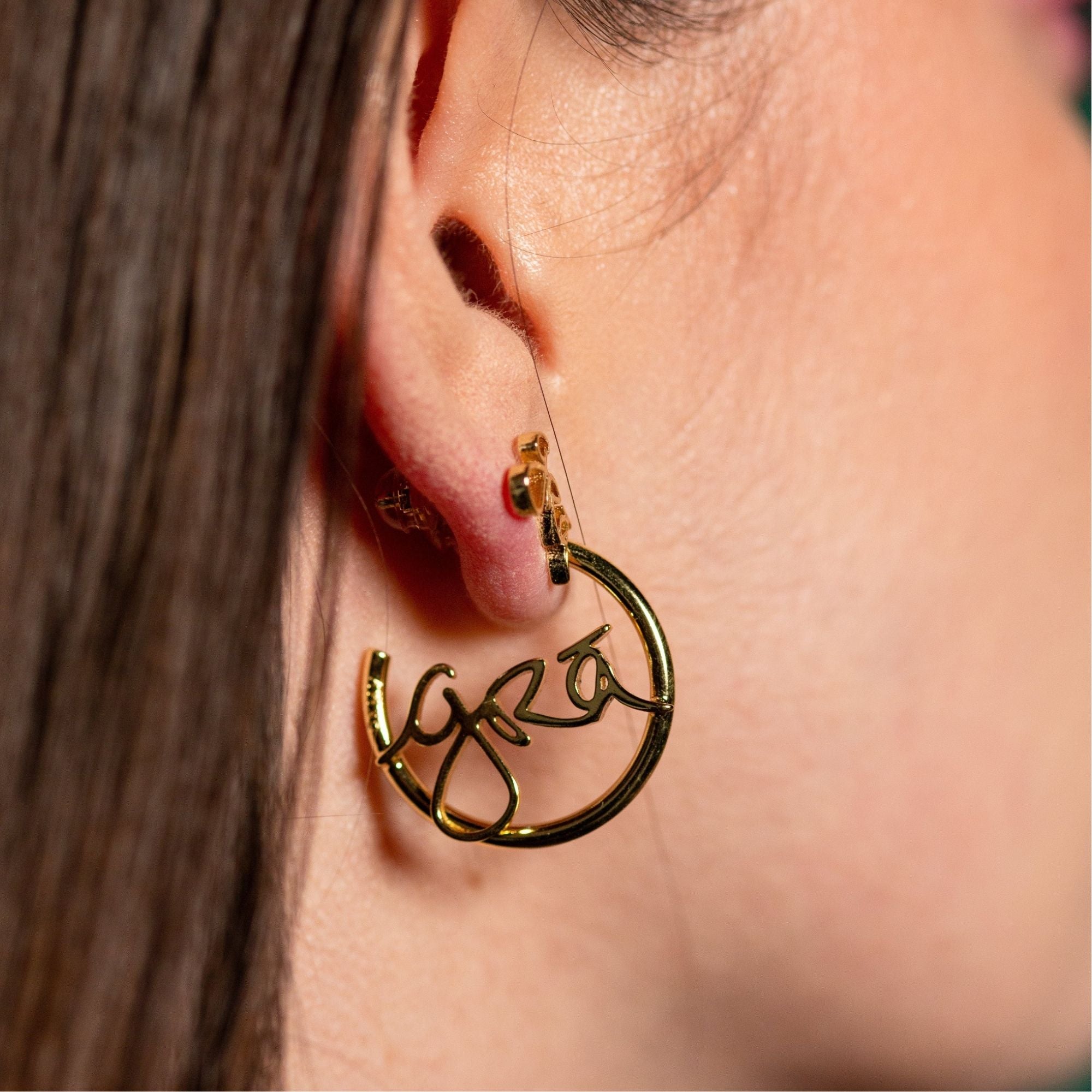 Side profile of Model wearing Grá Gold Hoop and Stud Earrings, Grá means Love in Irish Language. Designed in Ireland